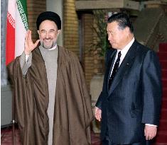 Mori, Khatami begin talks